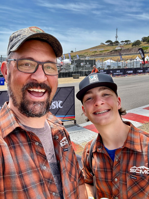 NICA coach and student-athlete in custom team flannels